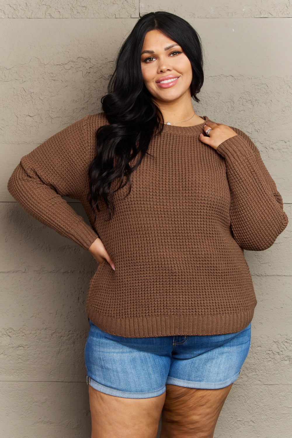 Brown waffle knit sweater with ribbed details styled casually