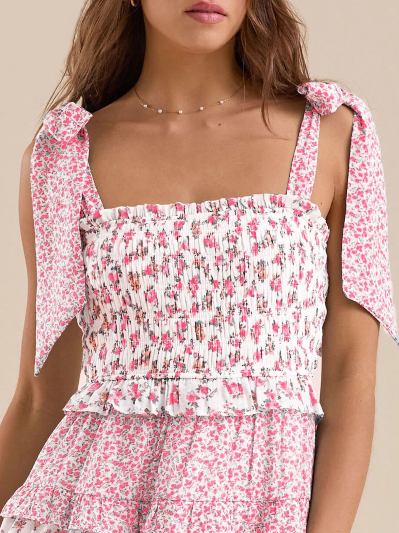 Front view of pink floral summer dress with tie-shoulder straps