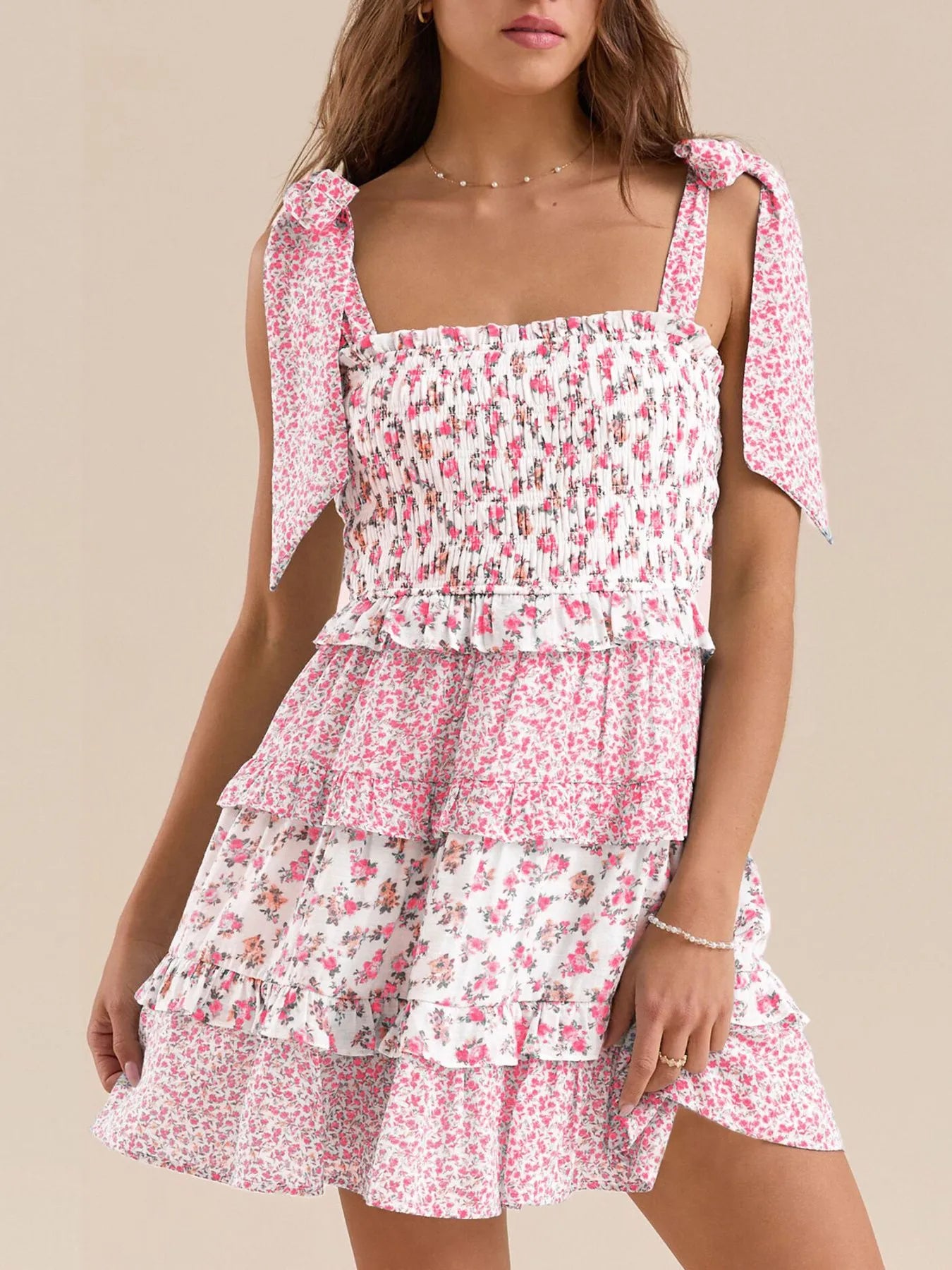 Pink floral smocked mini dress with ruffled tiered skirt