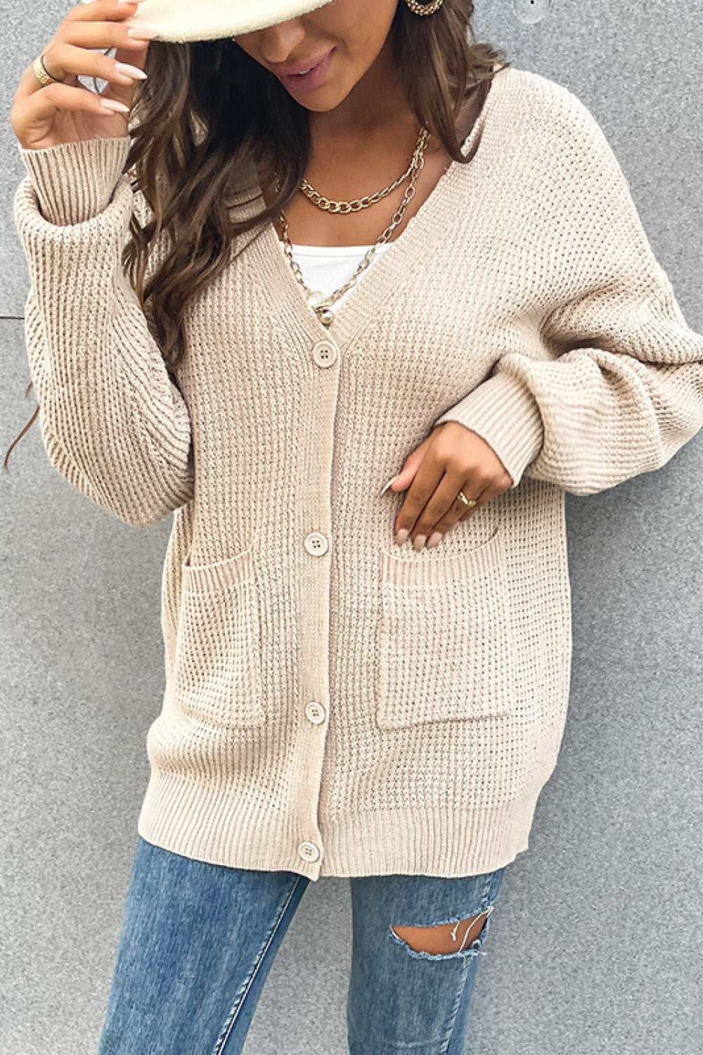 Front view of waffle knit cardigan with ribbed cuffs and pockets
