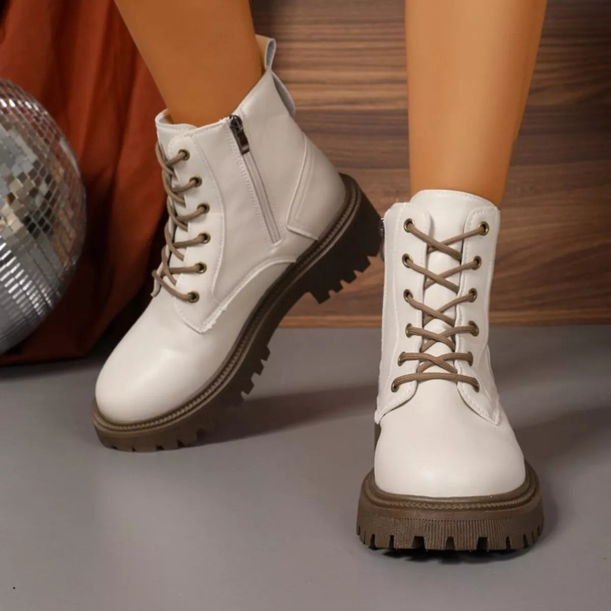White lace up boots shown with full outfit styling