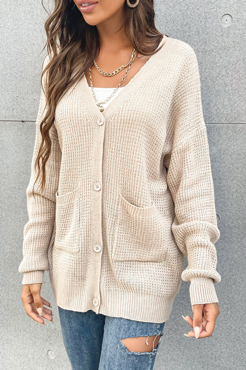 Beige waffle knit button-front cardigan with drop shoulders