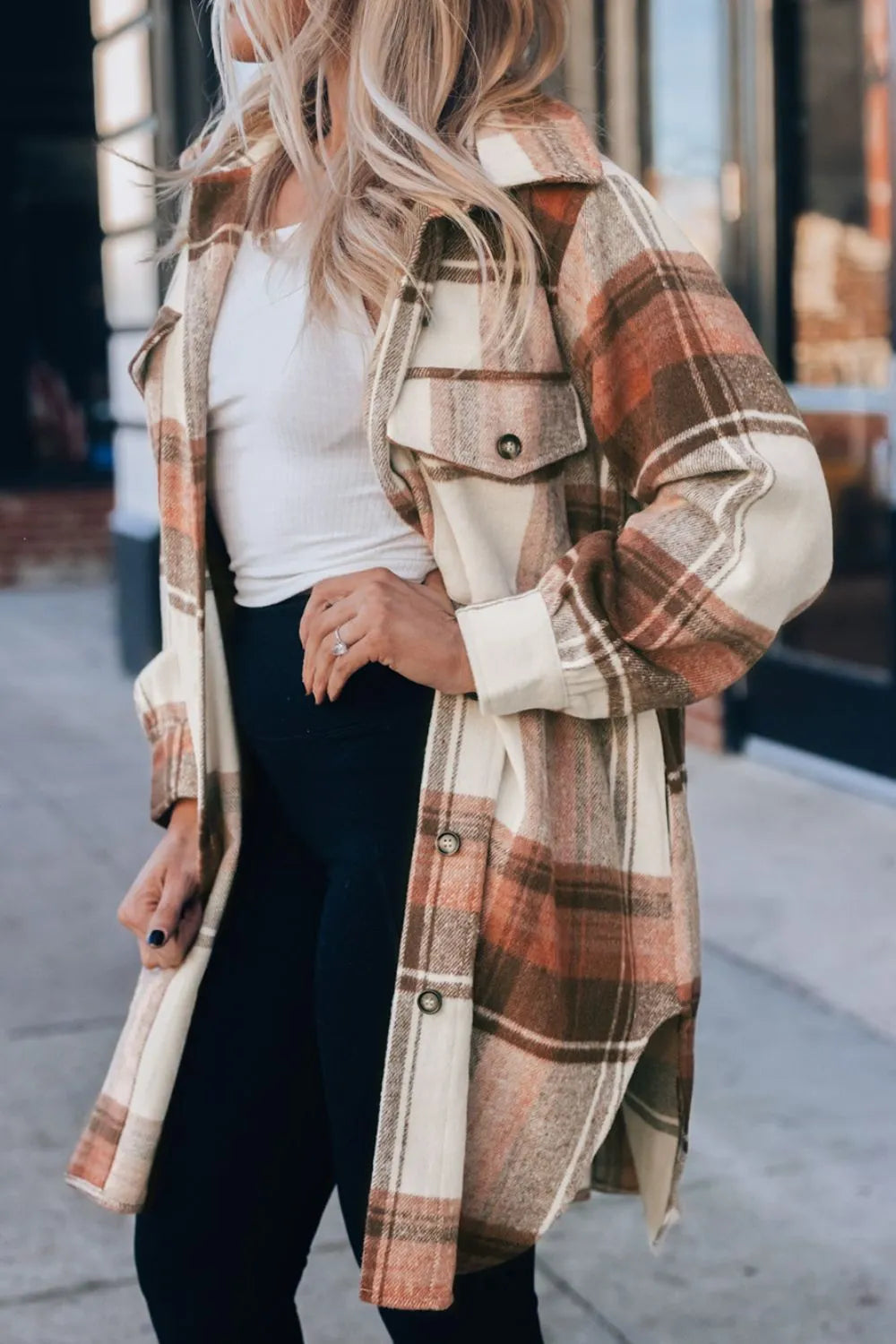 Side view of pocketed plaid shacket with mid-thigh length