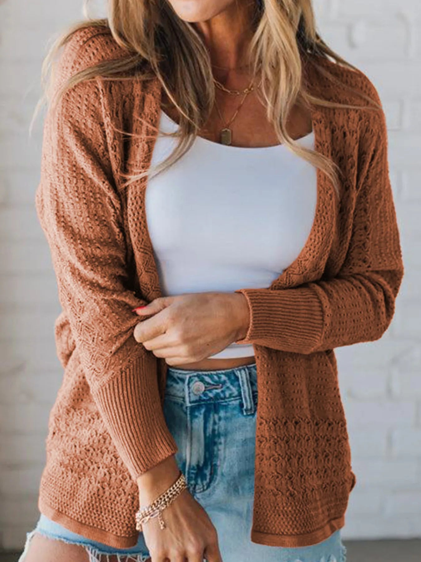 Brown knitted open front cardigan with eyelet details styled casual