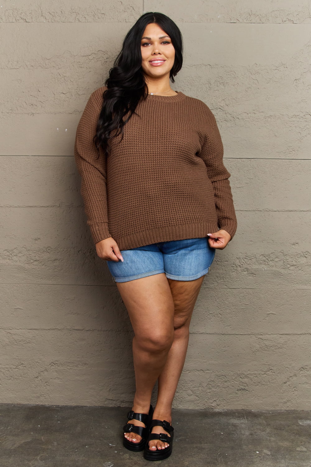 Plus size waffle knit sweater styled with denim shorts for fall