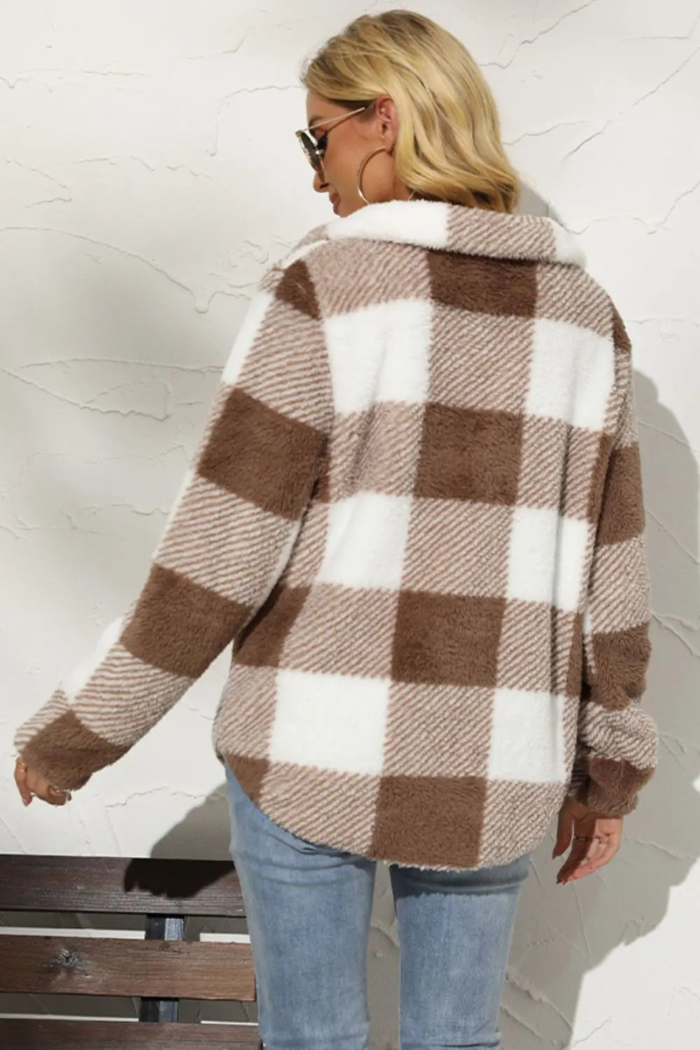 Back view of brown plaid fleece pullover with relaxed fit