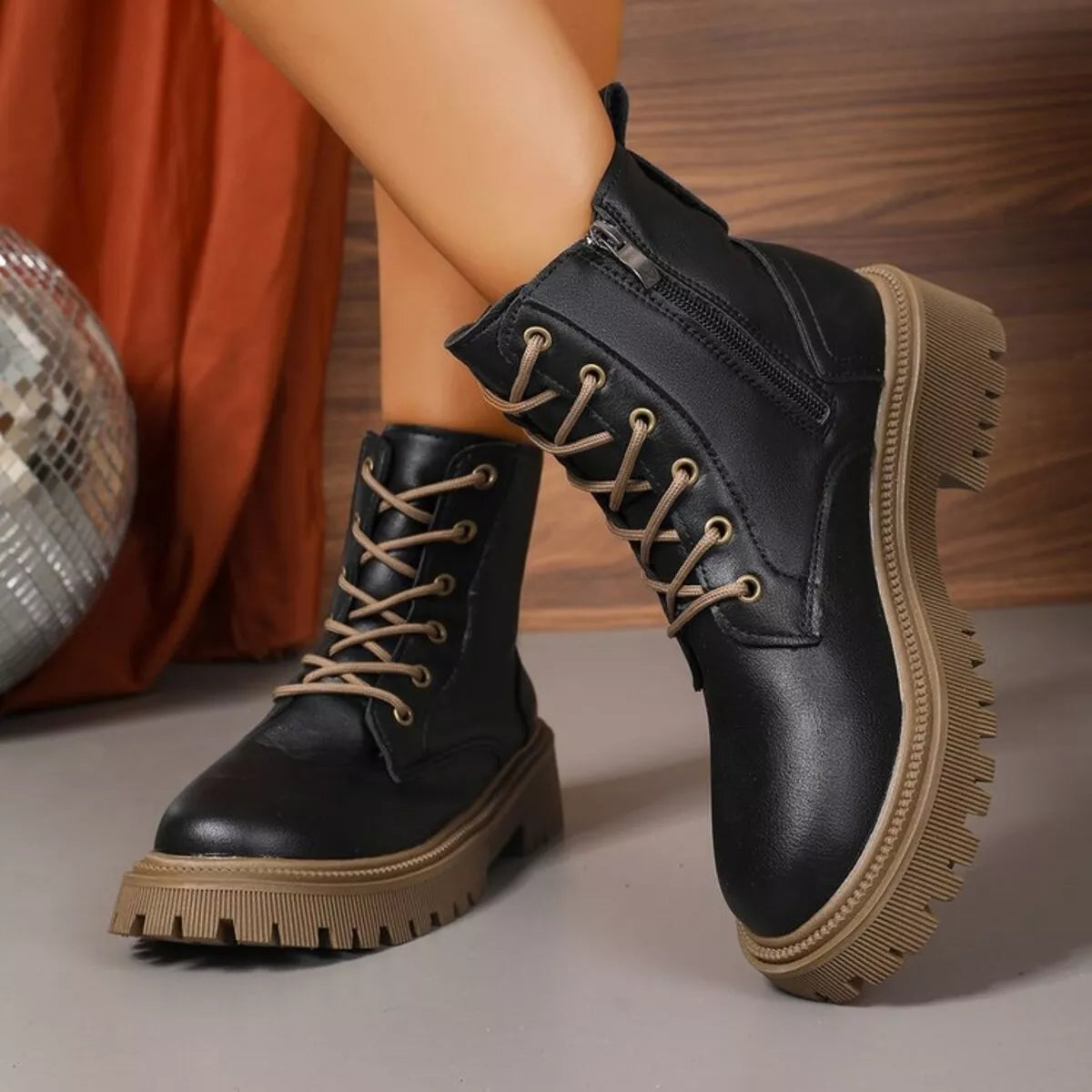 Black combat style boots paired with casual outfit