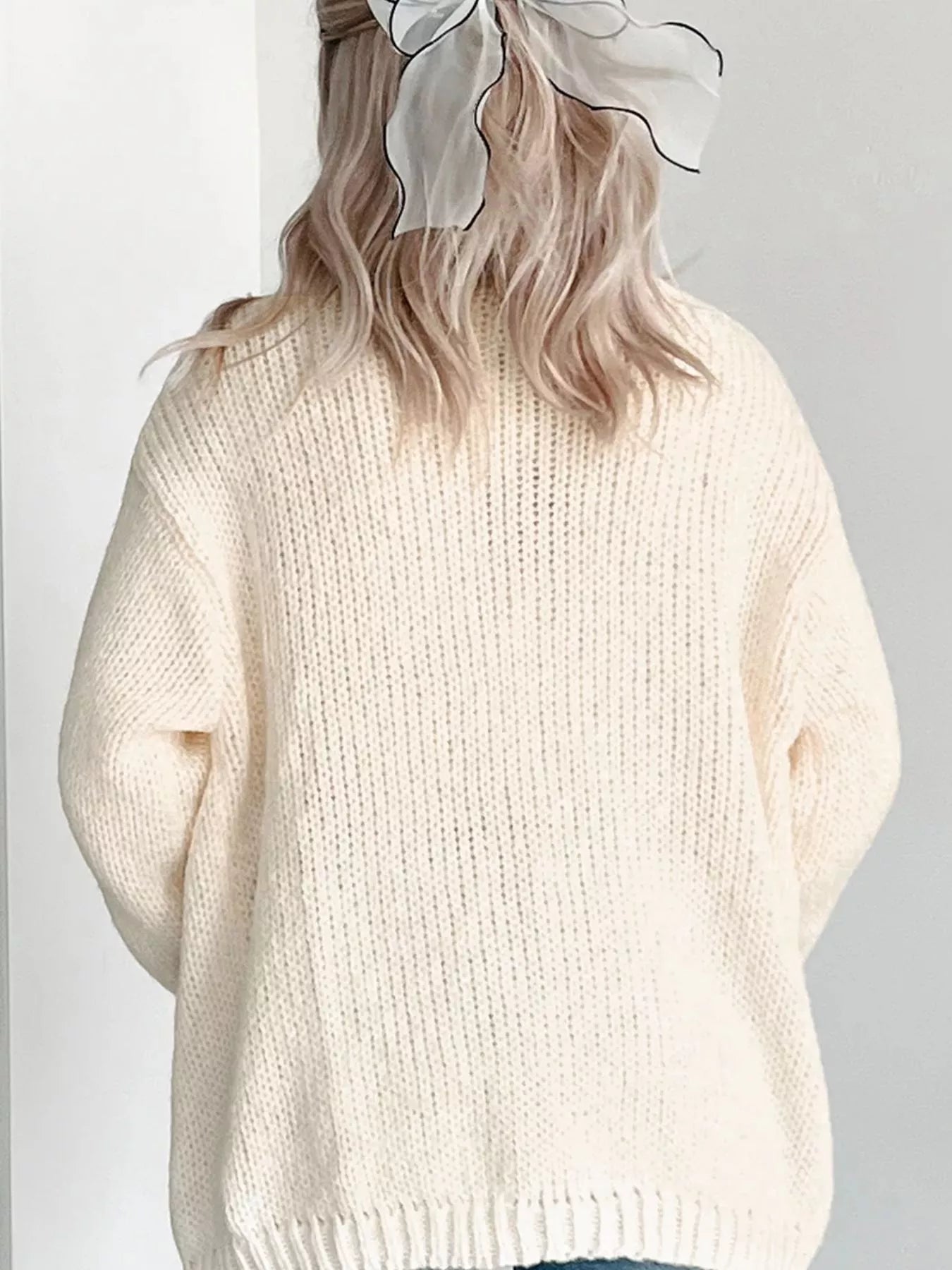 Back view of Halloween pumpkin knit cardigan in ivory