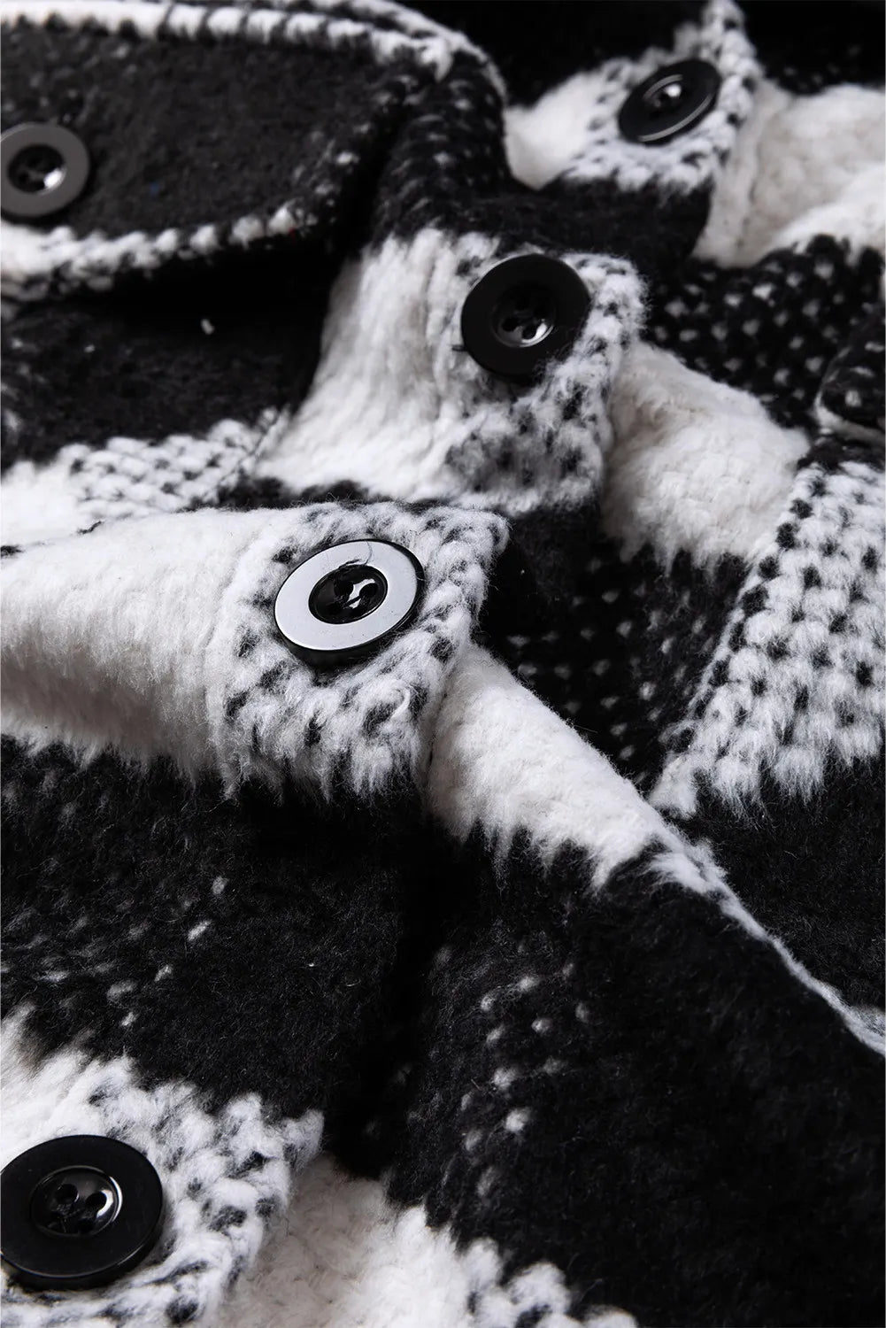 Close-up of plaid jacket fabric texture in black and white check
