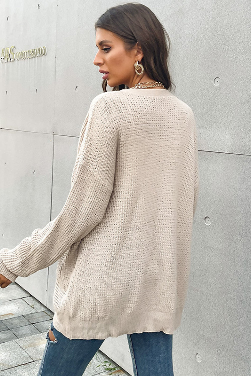 Back view of waffle knit button-front cardigan for casual layering