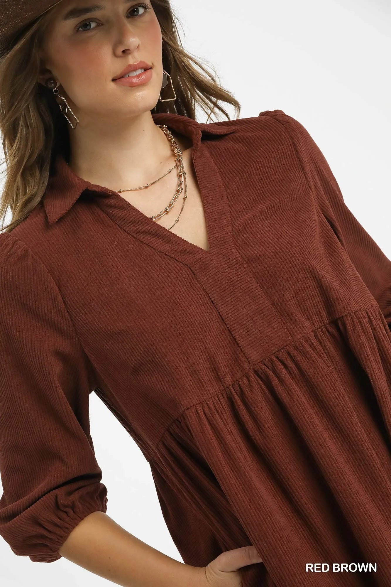 Close-up of corduroy mini dress showing textured fabric and neckline