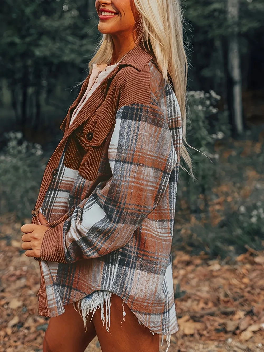 Side angle of plaid button-down shacket layered over casual fall outfit